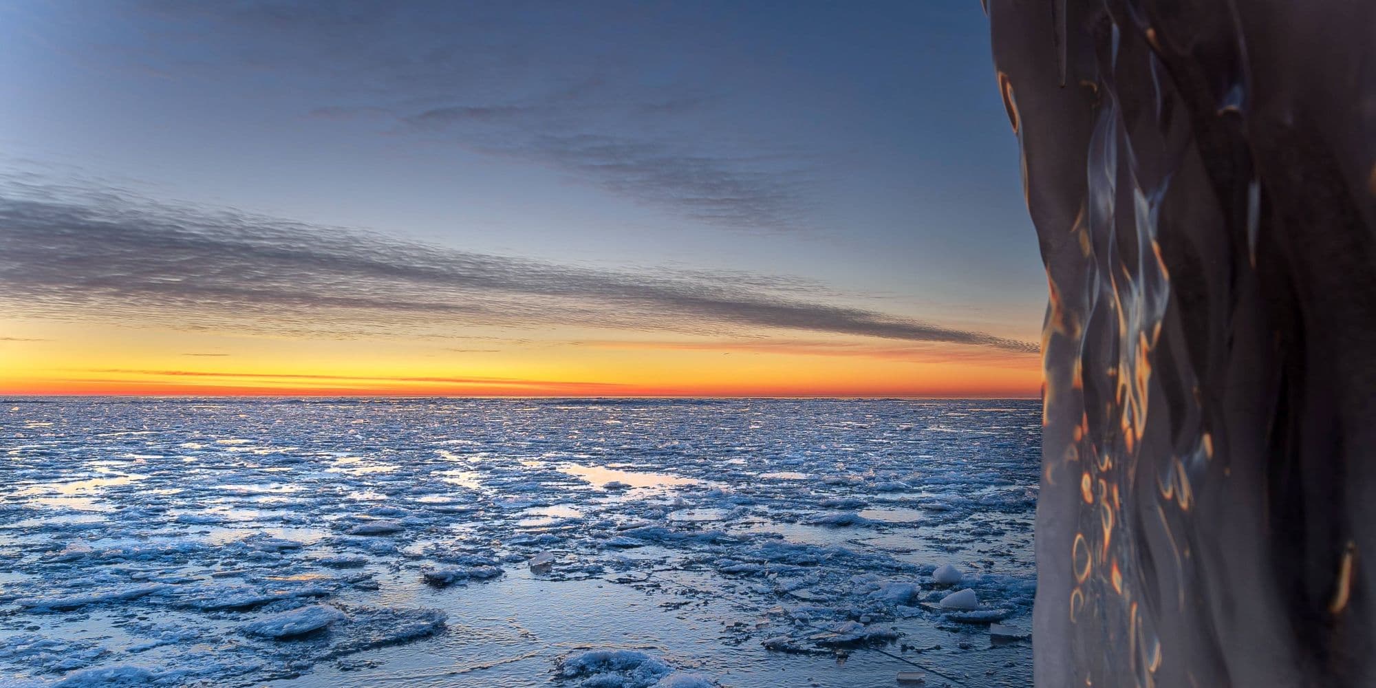 Antarctic landscape showing ice shelf and mountains