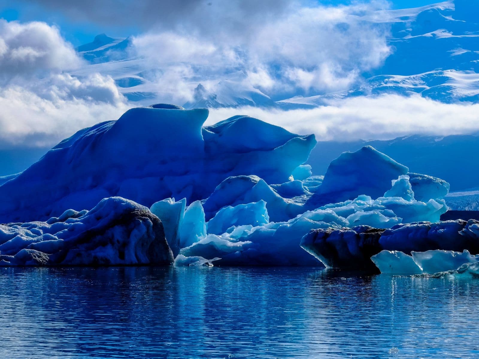 Vast Antarctic ice sheet with mountains in background